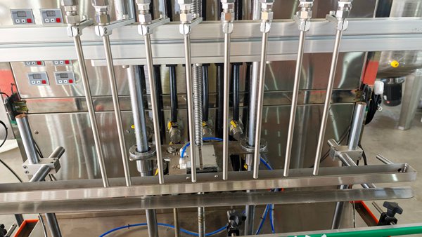 Close-up of multi stainless steel filling nozzles for liquid soap filling machine, anti-drip nozzle design