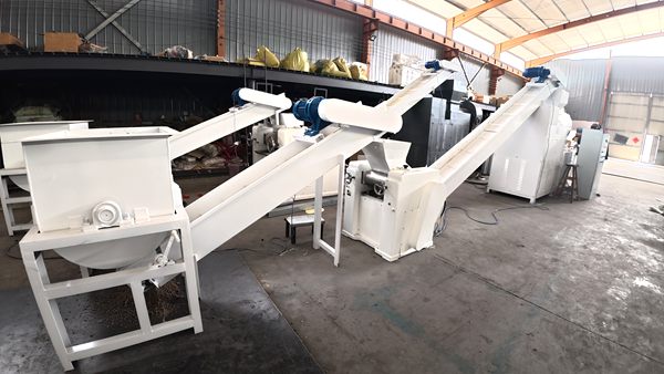 SWorkshop view of small soap pretreatment line with mixer, screw conveyor and triple roll mill