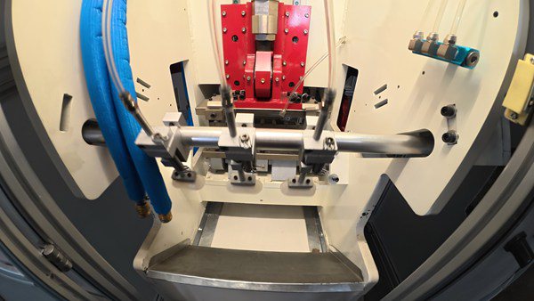 Close-up view of soap stamping machine pneumatic pressing mechanism for solid soap forming
