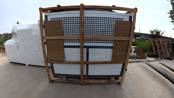 Bar soap manufacturing machine secured in wooden crate, ready for container loading